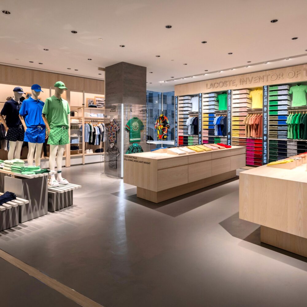 Third-floor interior of Lacoste Flagship Store, Fifth Avenue, New York, showcasing clothing and mannequins illuminated by Zeplinn’s architectural lighting.