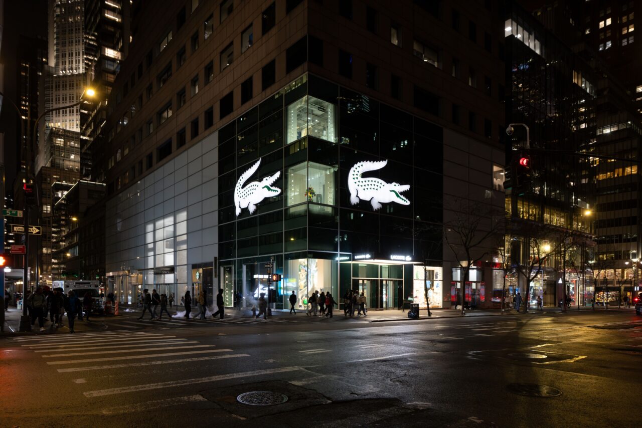 Exterior view of the Lacoste Flagship Store on Fifth Avenue, New York, illuminated with Zeplinn’s architectural lighting across two floors.