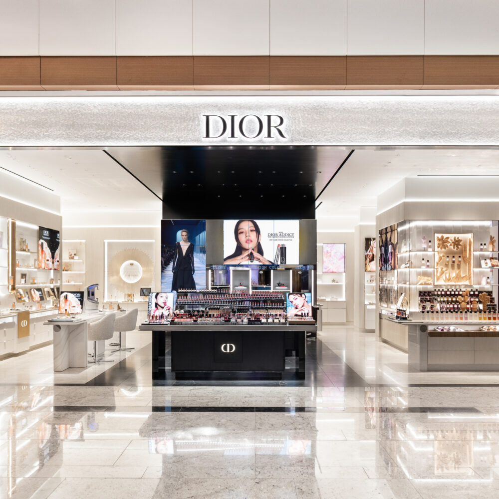 Exterior view of Parfums Christian Dior boutique at Raffles City Singapore featuring elegant façade lighting supplied by Zeplinn.