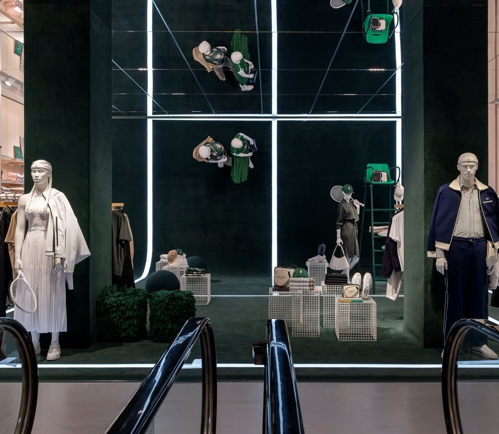 Escalator leading to the second floor of Lacoste Flagship Store, Fifth Avenue, New York, with mannequins on each side illuminated by Zeplinn’s architectural lighting.