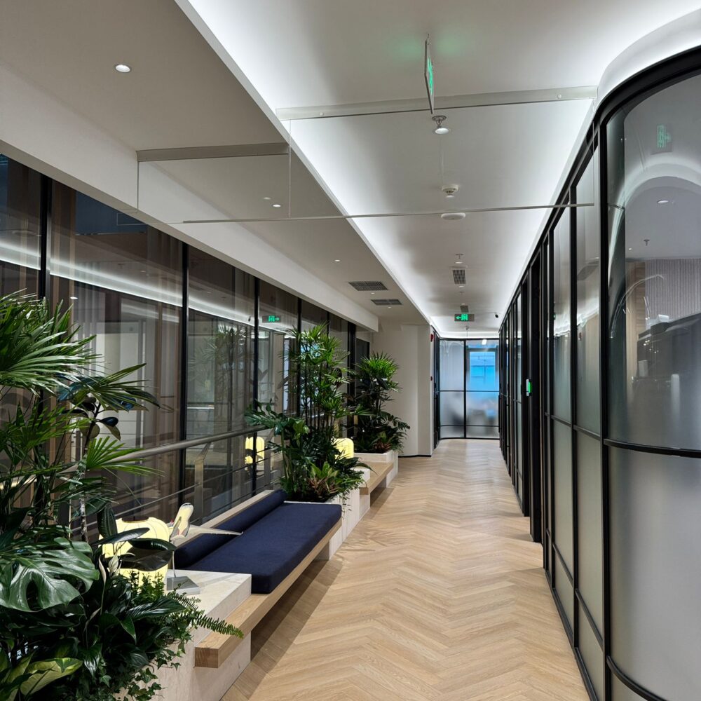 Office corridor with sofa on the left, lit by Zeplinn architectural lighting at French Chamber of Commerce Shanghai