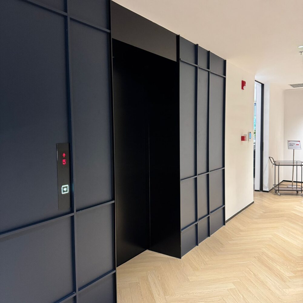 Lobby area in front of elevator at French Chamber of Commerce Shanghai under Zeplinn architectural lighting