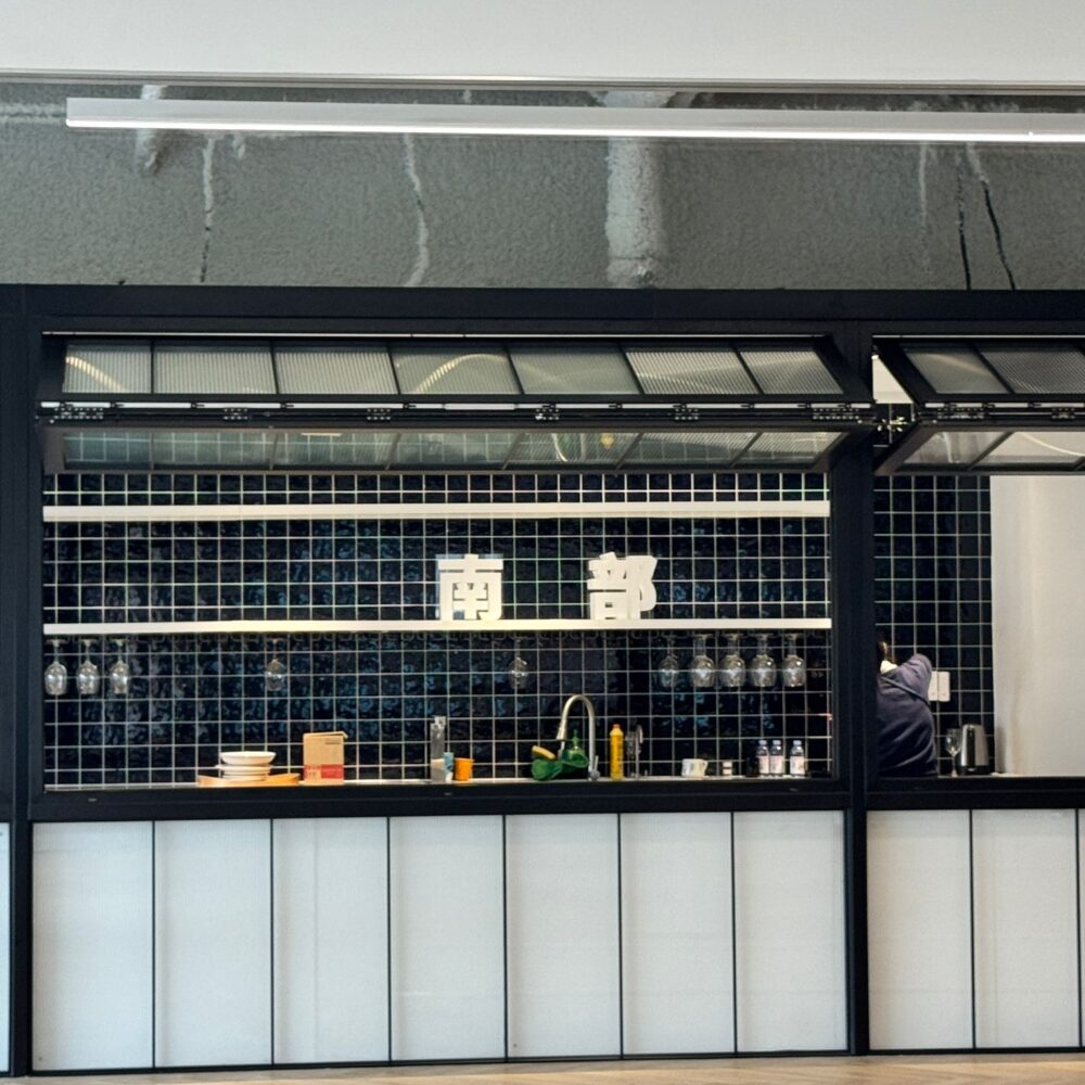 Kitchen area at French Chamber of Commerce Shanghai illuminated with Zeplinn architectural lighting