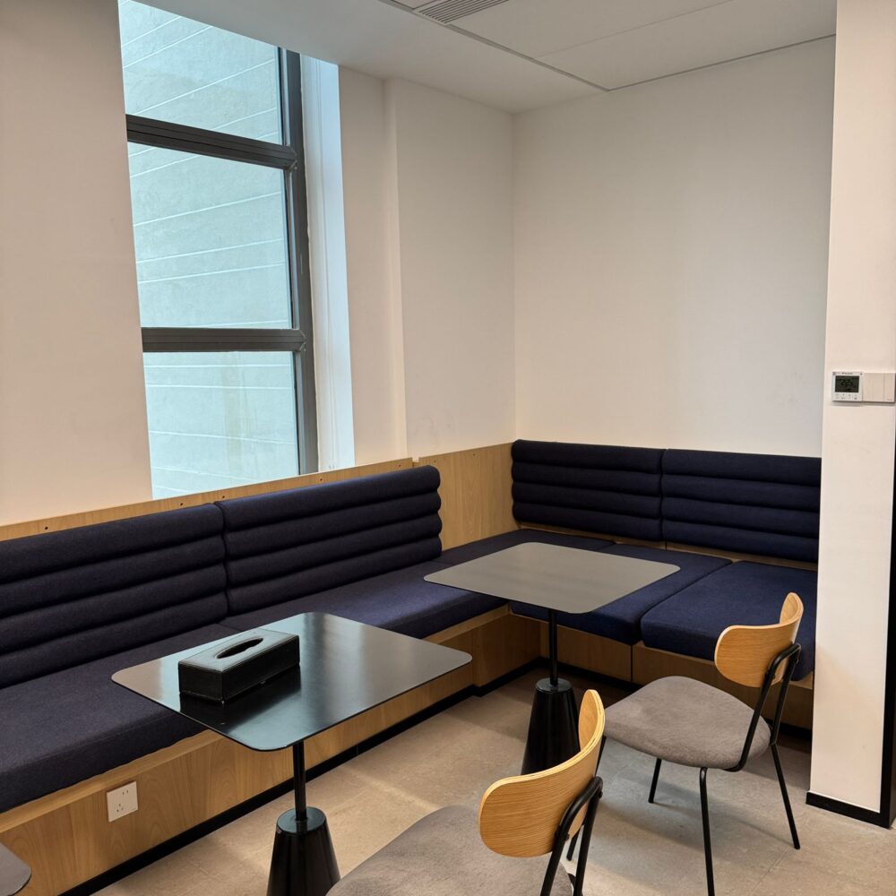 Sitting area with tables at French Chamber of Commerce Shanghai lit by Zeplinn architectural lighting