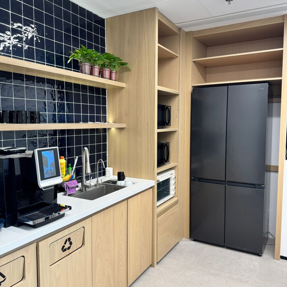 Break area with coffee machine at French Chamber of Commerce Shanghai under Zeplinn architectural lighting