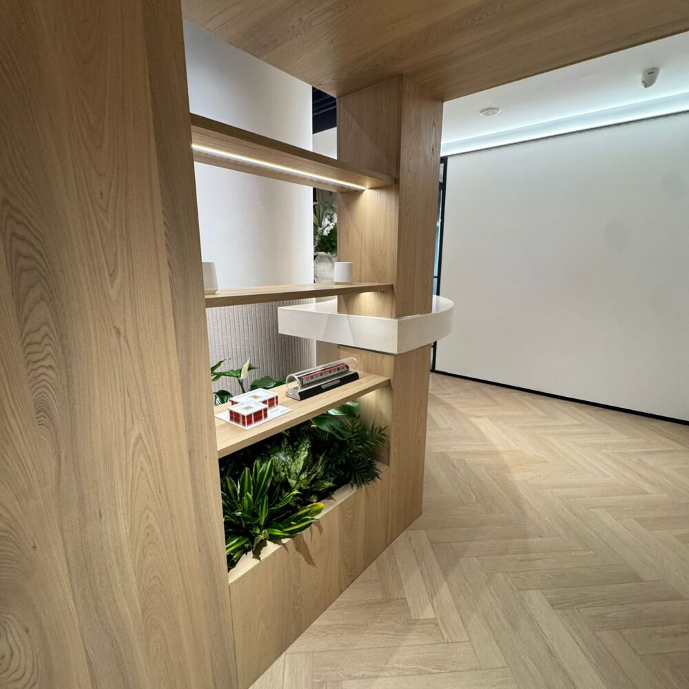 Decorative corner with shelves and plants at French Chamber of Commerce Shanghai illuminated by Zeplinn architectural lighting