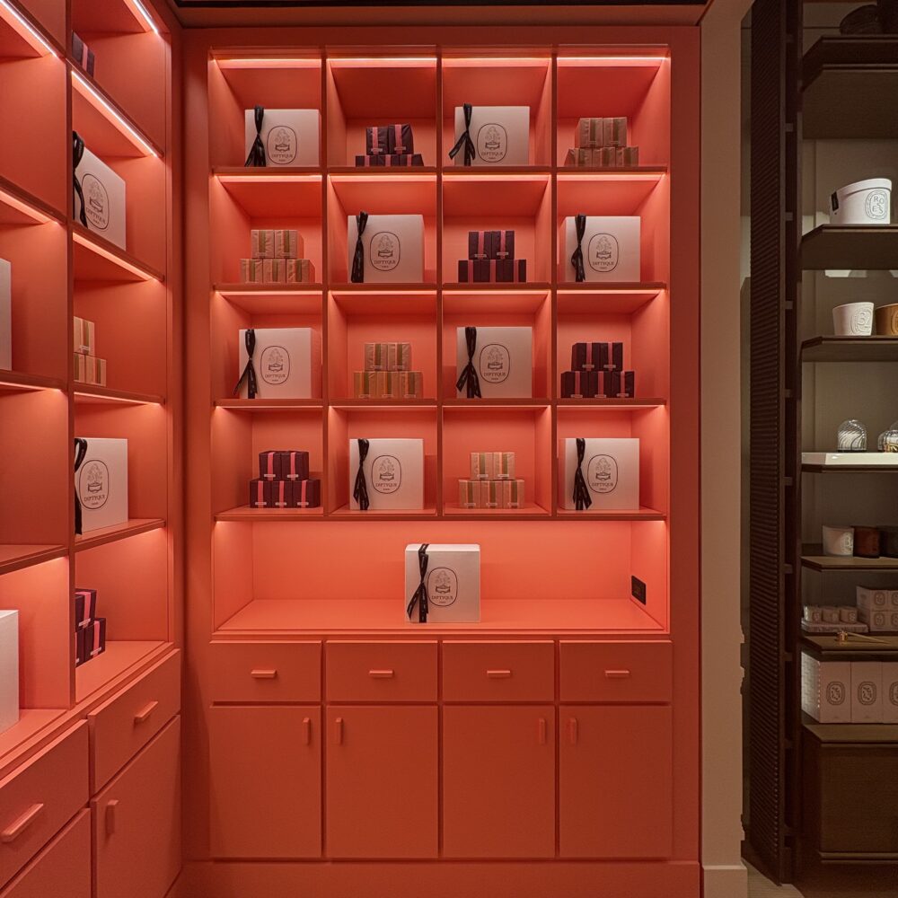 Corner product display in Diptyque Miami Brickell lit with Zeplinn architectural lighting