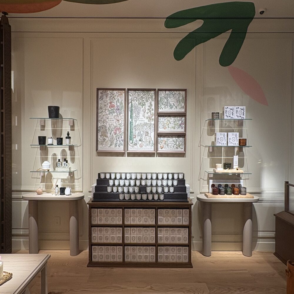 Wall-mounted candle and fragrance displays at Diptyque Miami Brickell under Zeplinn architectural lighting