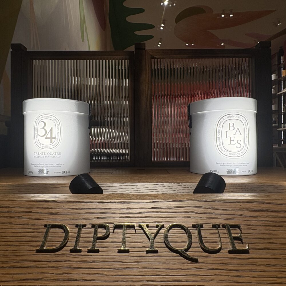 Central product table in Diptyque Miami Brickell store lit by Zeplinn architectural lighting