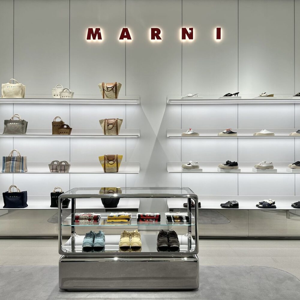Marni Changsha boutique handbags displayed on illuminated shelves beneath the Marni logo, lit by Zeplinn’s precision 3500K architectural lighting.