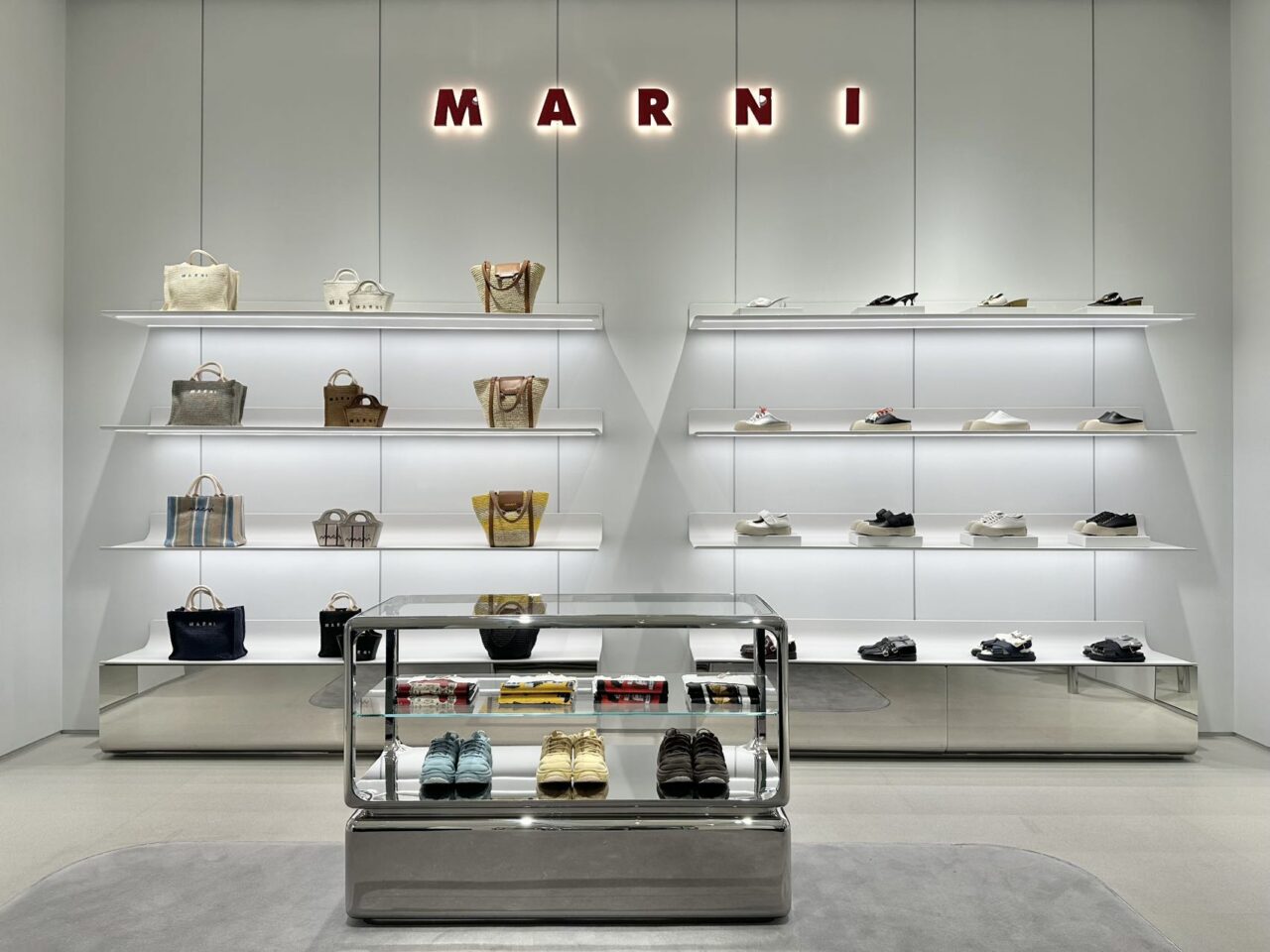 Marni Changsha boutique handbags displayed on illuminated shelves beneath the Marni logo, lit by Zeplinn’s precision 3500K architectural lighting.