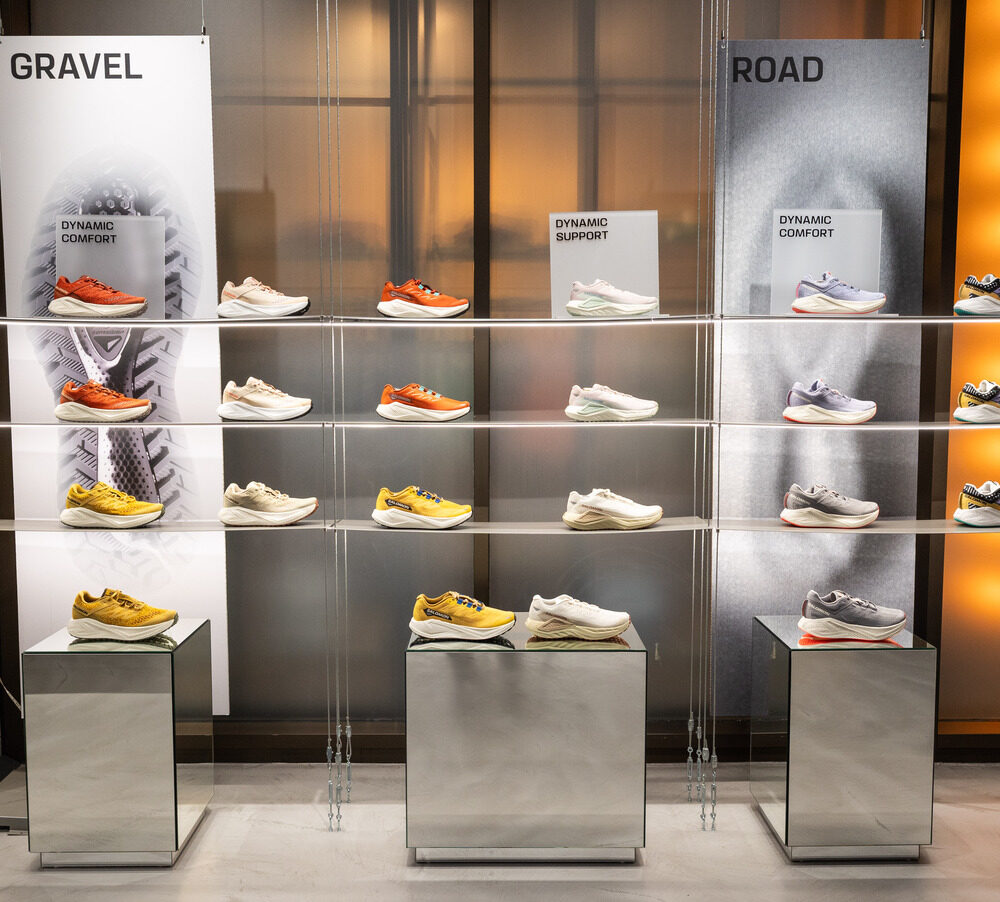 Salomon Battersea shoes displayed on illuminated shelves under Zeplinn architectural lighting.
