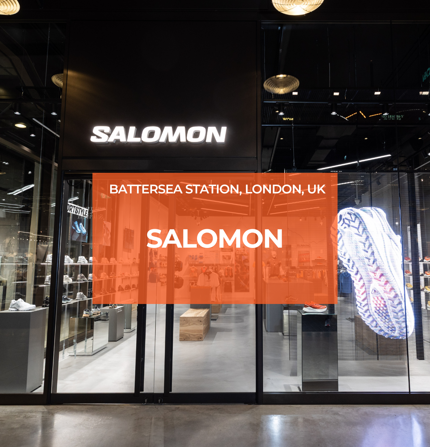 Entrance of Salomon Battersea store illuminated by Zeplinn fixtures, with a holographic shoe display and precision 4000K CRI95 lighting.