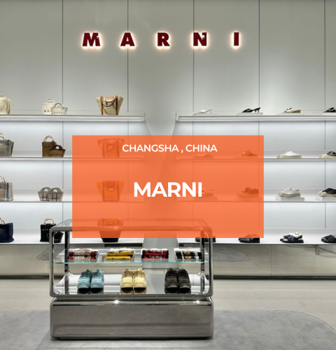 Marni Changsha boutique handbags displayed on illuminated shelves beneath the Marni logo, lit by Zeplinn’s precision 3500K architectural lighting.