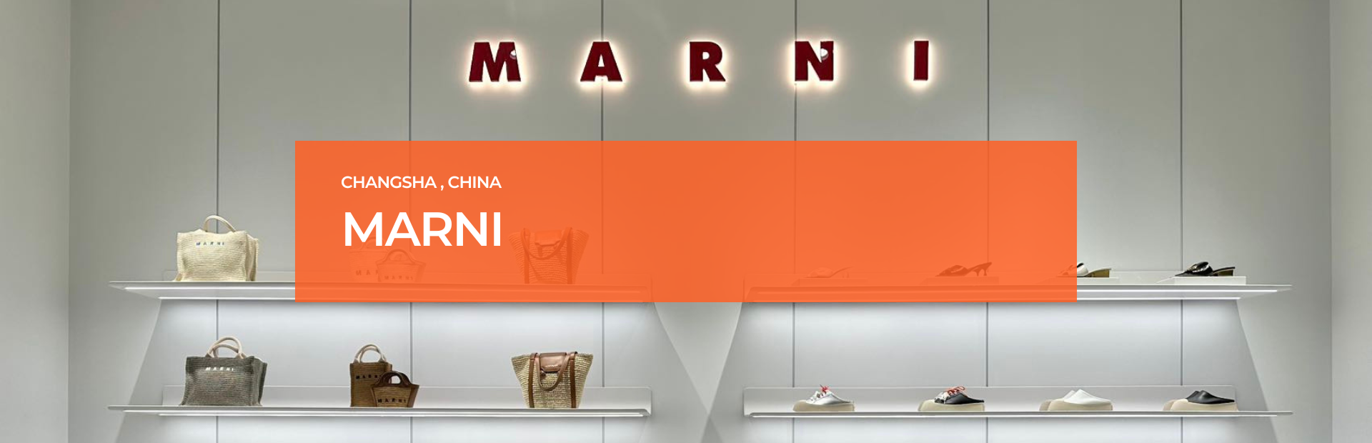 Marni Changsha boutique handbags displayed on illuminated shelves beneath the Marni logo, lit by Zeplinn’s precision 3500K architectural lighting.