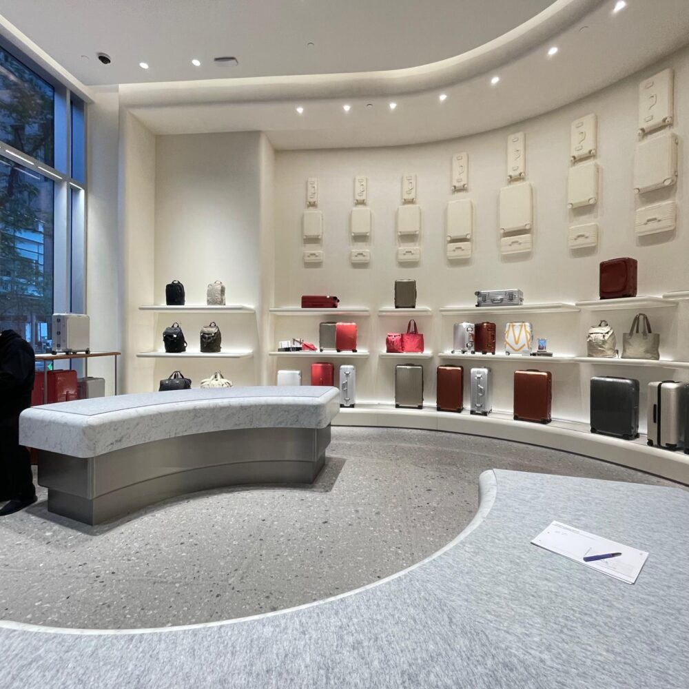 Interior of RIMOWA 5th Avenue store illuminated by Zeplinn architectural lighting showcasing full luggage collection